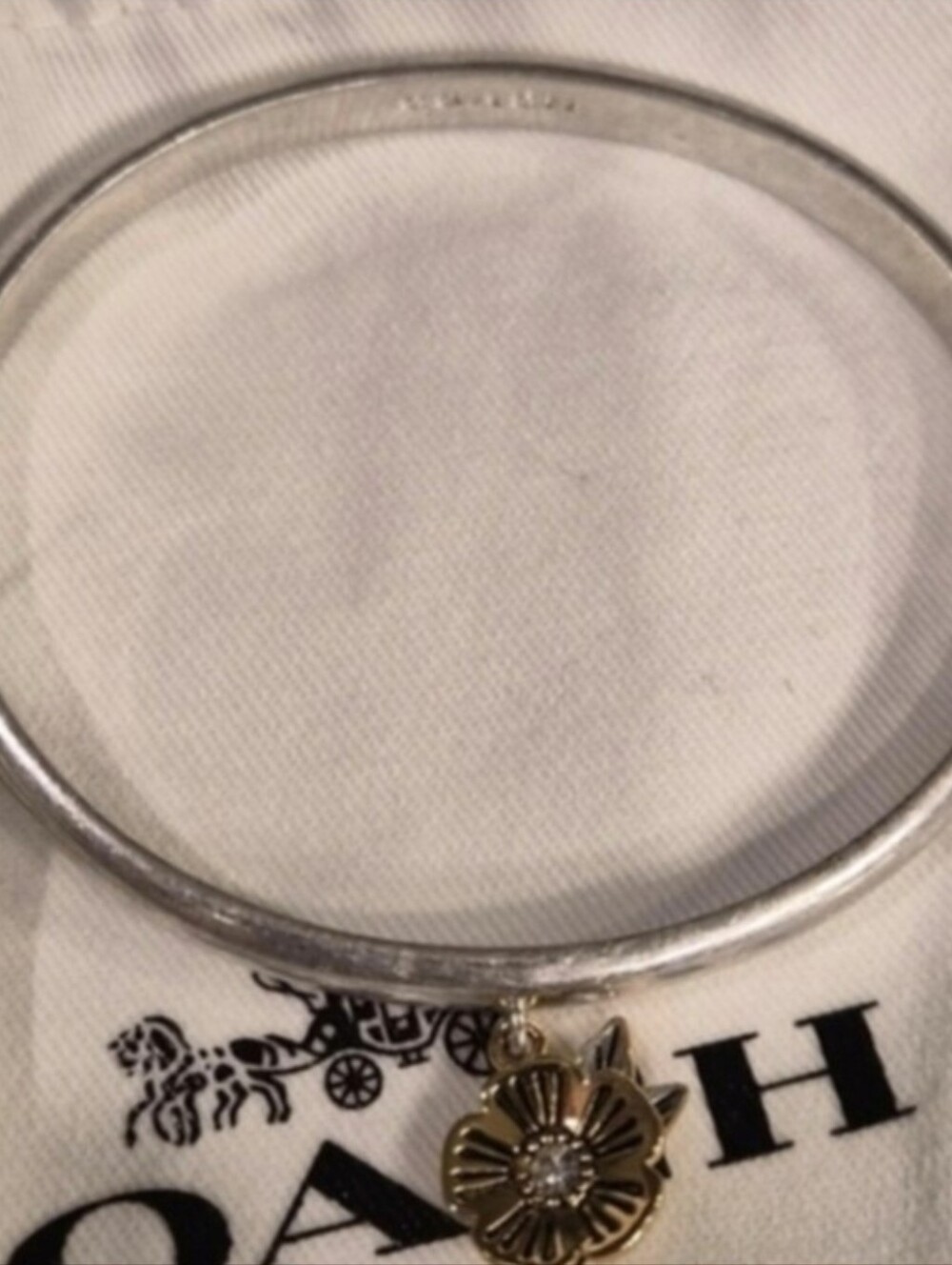 Coach Silver Bangle with Gold Flower Charm